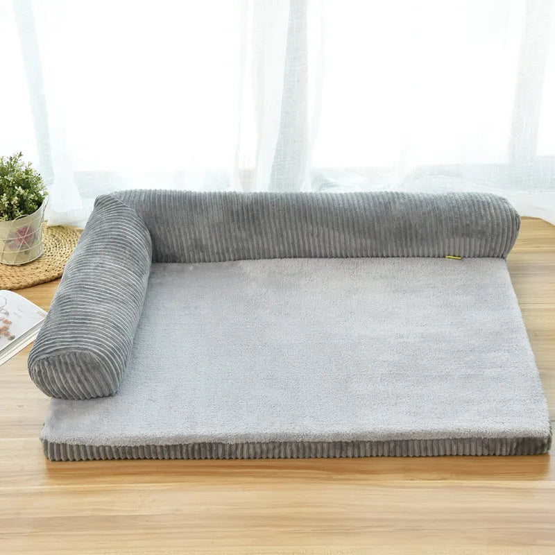 Corduroy pet sofa dog bed with bolster in grey colour, showing non-slip base and high-density sponge padding