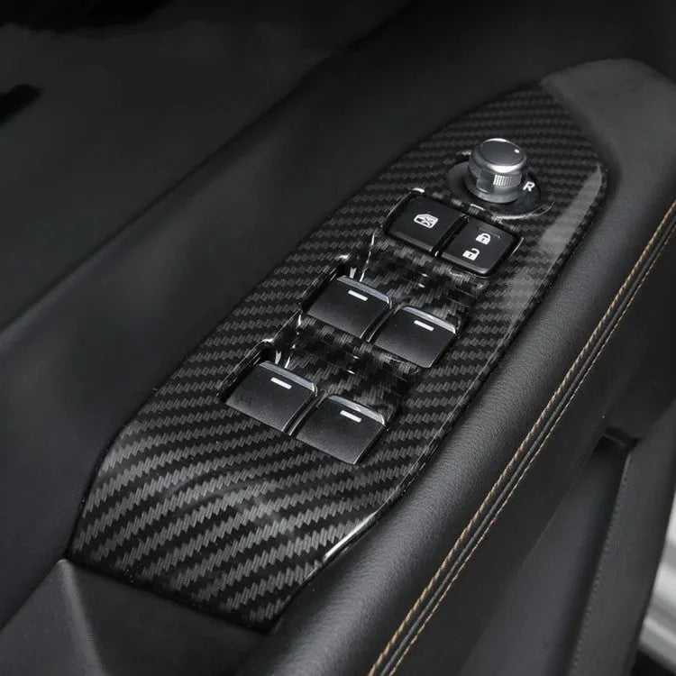 Pair of carbon fibre style ABS plastic steering wheel frame decorative covers for car dashboard installation.