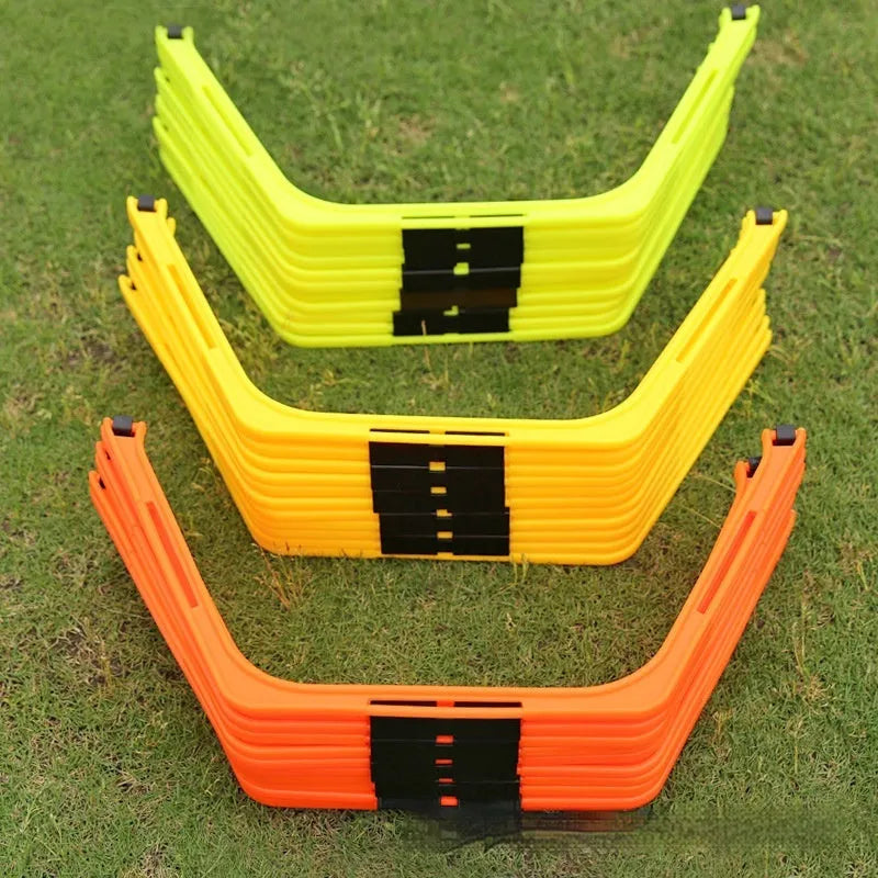 Set of six foldable yellow, green, and orange plastic hexagon football agility training rings laid out on grass.