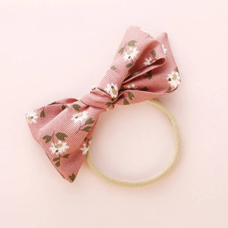 Children's knotted bow hair band in cloth with printed bow detail, Princess series Snow White style, six colours available