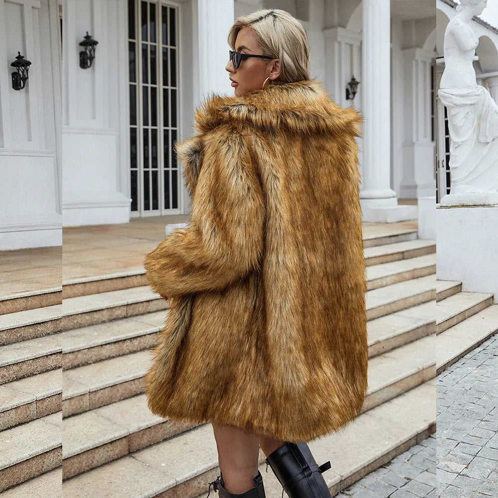 Yellow loose-fit women's faux fur coat with regular sleeves on a hanger
