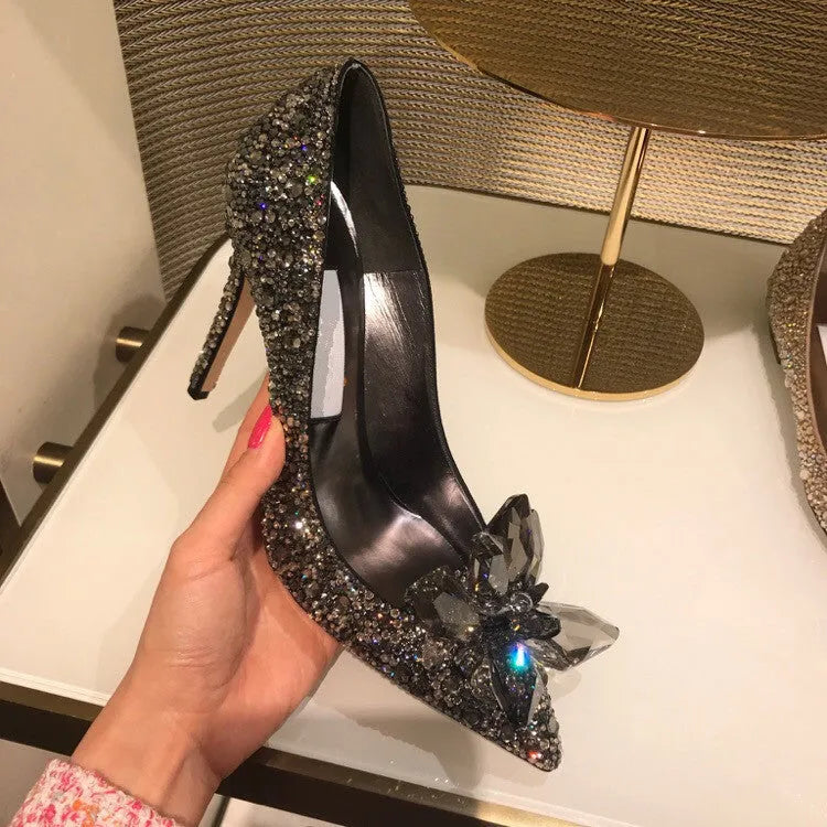 Gold and silver women's stiletto high heels with sequined pointed toes and rhinestone decoration.