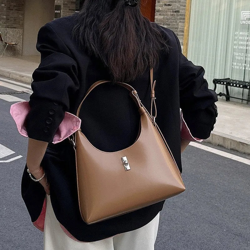 Genuine leather crossbody shoulder bag in dumpling shape with organised compartments