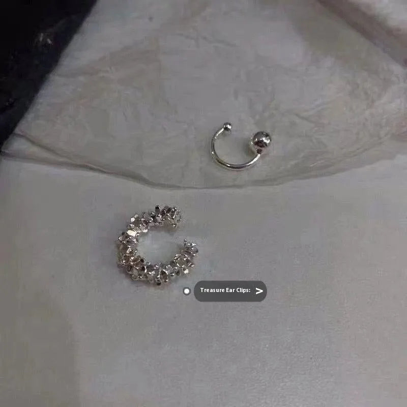 A pair of frosty B4710# coloured geometric ear clip earrings with an irregular shape.