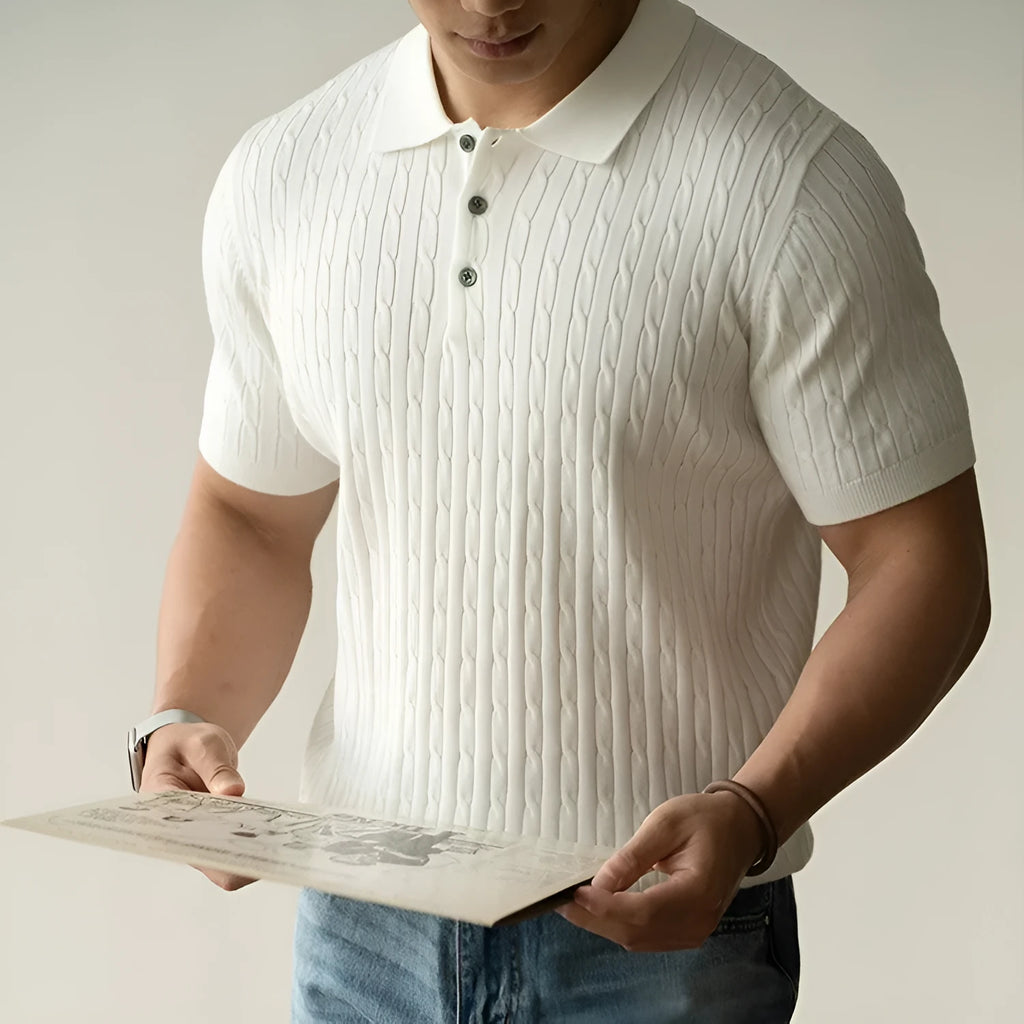 Men's khaki short sleeve business casual top on a hanger.