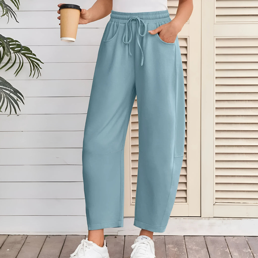 Loose cotton cropped sweatpants with drawstring waist in apricot colour showing street fashion styling
