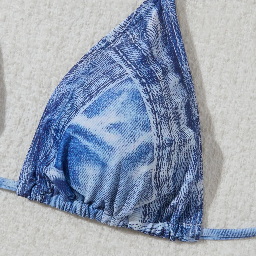 Women's denim blue printed strap bikini set on white background