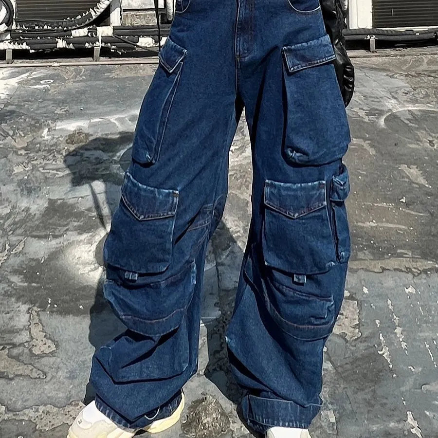 Dark blue distressed women's jeans with a high waist, wide legs, and multiple workwear-style pockets.