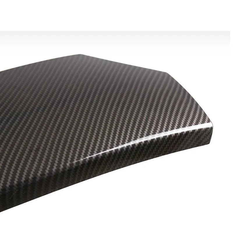 Set of three glossy black carbon fibre pattern ABS protective covers for a car armrest box.
