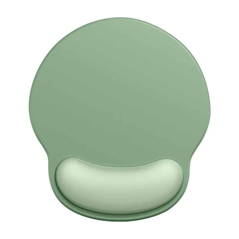 Silicone mouse mat with raised wrist rest in a gradient colour design on a desk.