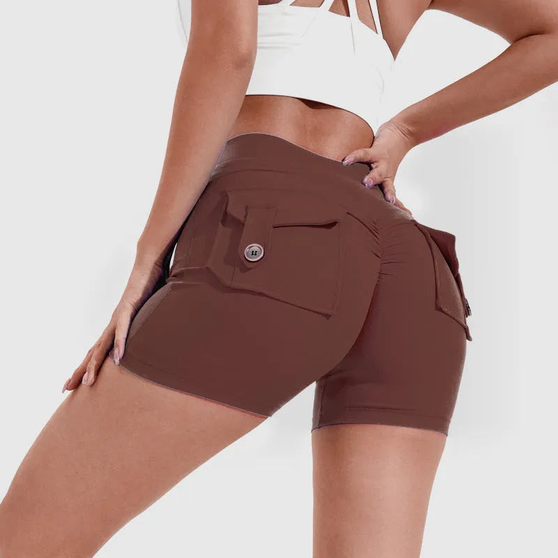 Women's high-waist fitness shorts in quick-dry nylon with side pockets, shown in Electric Blue.