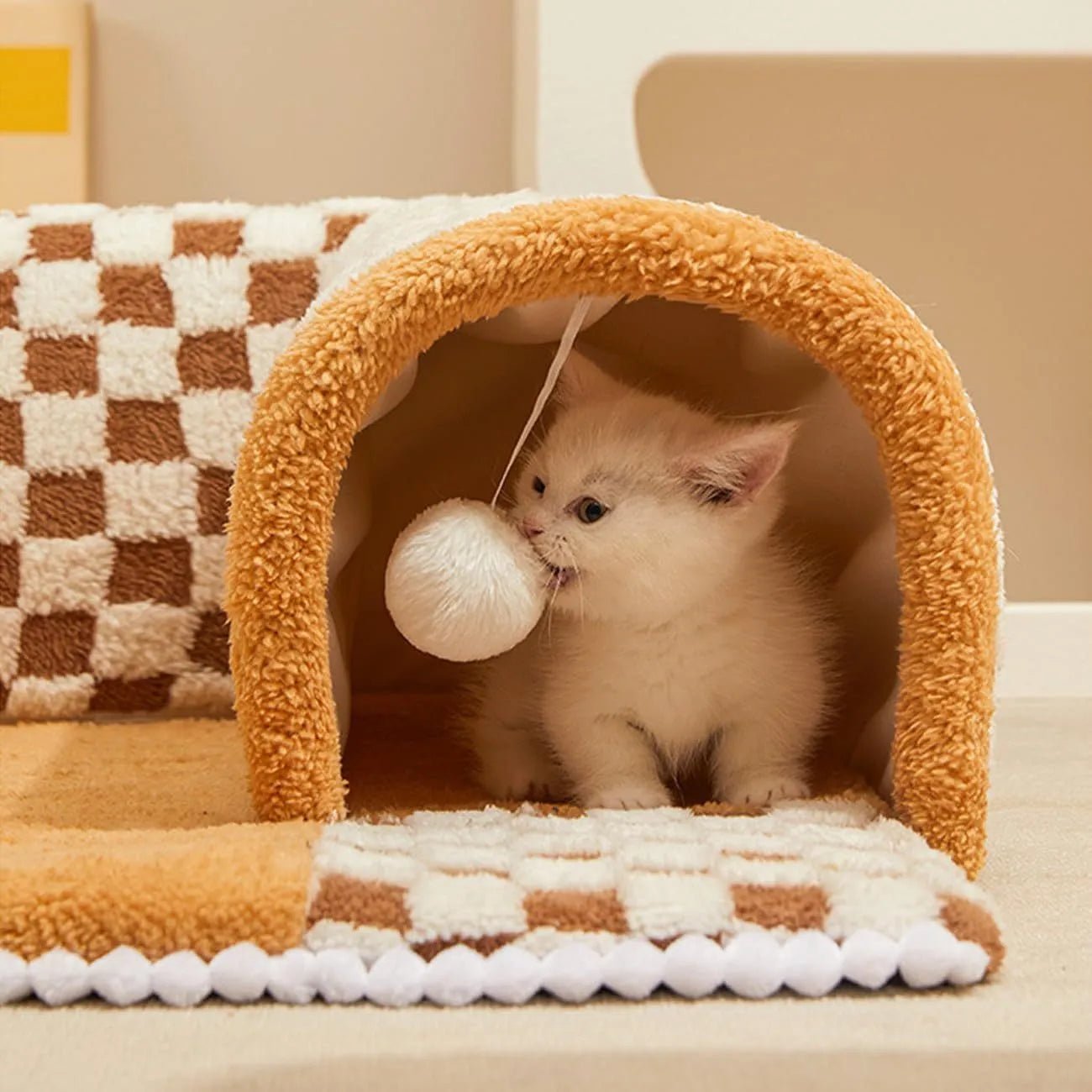 XL sized fan-shaped plush pet bed with integrated tunnel, shown in coffee colour with a non-slip granular base.