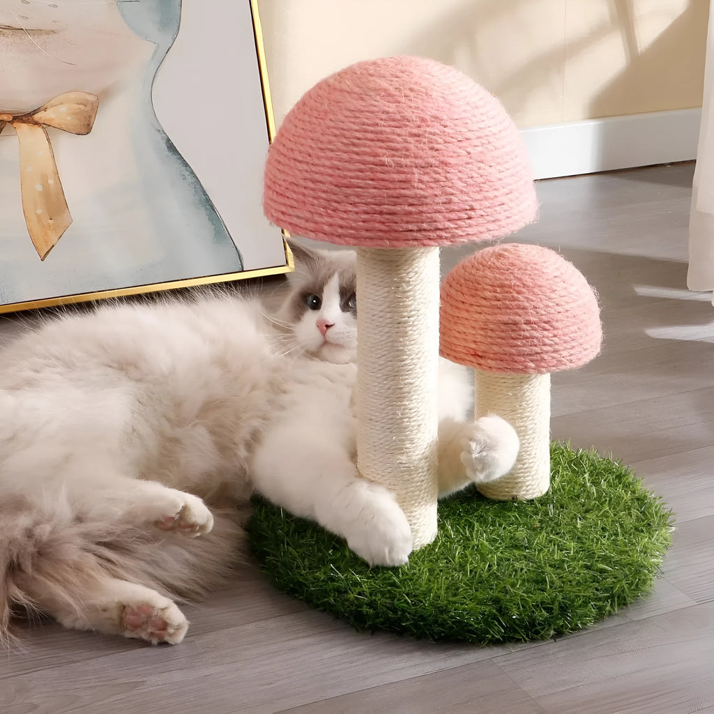 Pink mushroom-shaped cat scratching post with sisal fibre caps and pole for small cats.