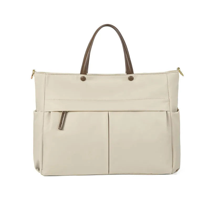 Women's oxford cloth laptop briefcase in elegant black showing open pocket and stitching detail