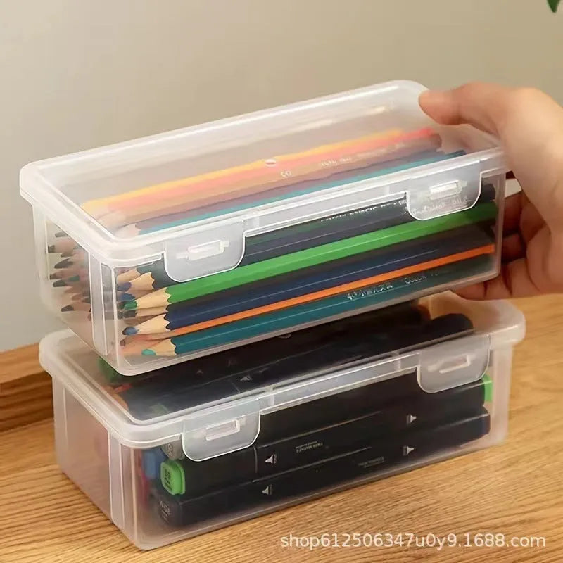 Transparent plastic pencil storage box showing interior capacity for organising drawing supplies