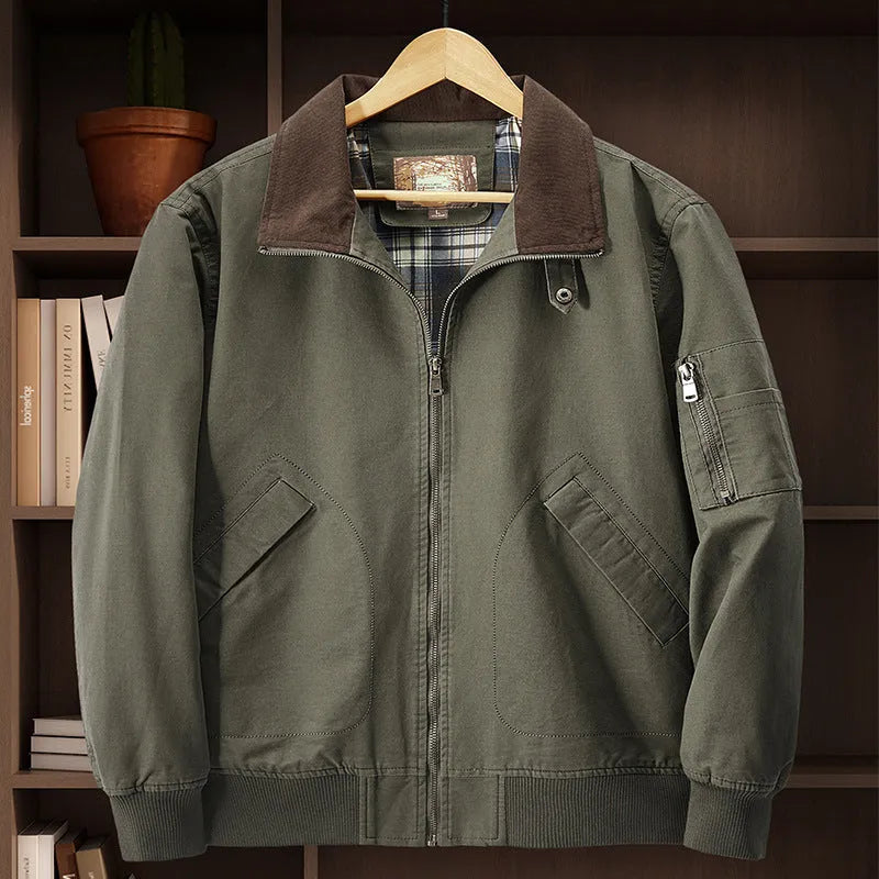 Plus size men's beige washed cotton baseball flight jacket on a hanger