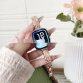 Zinc alloy twist-design Apple Watch band in silver, rose gold, gold, black, and starlight colours on a grey background.