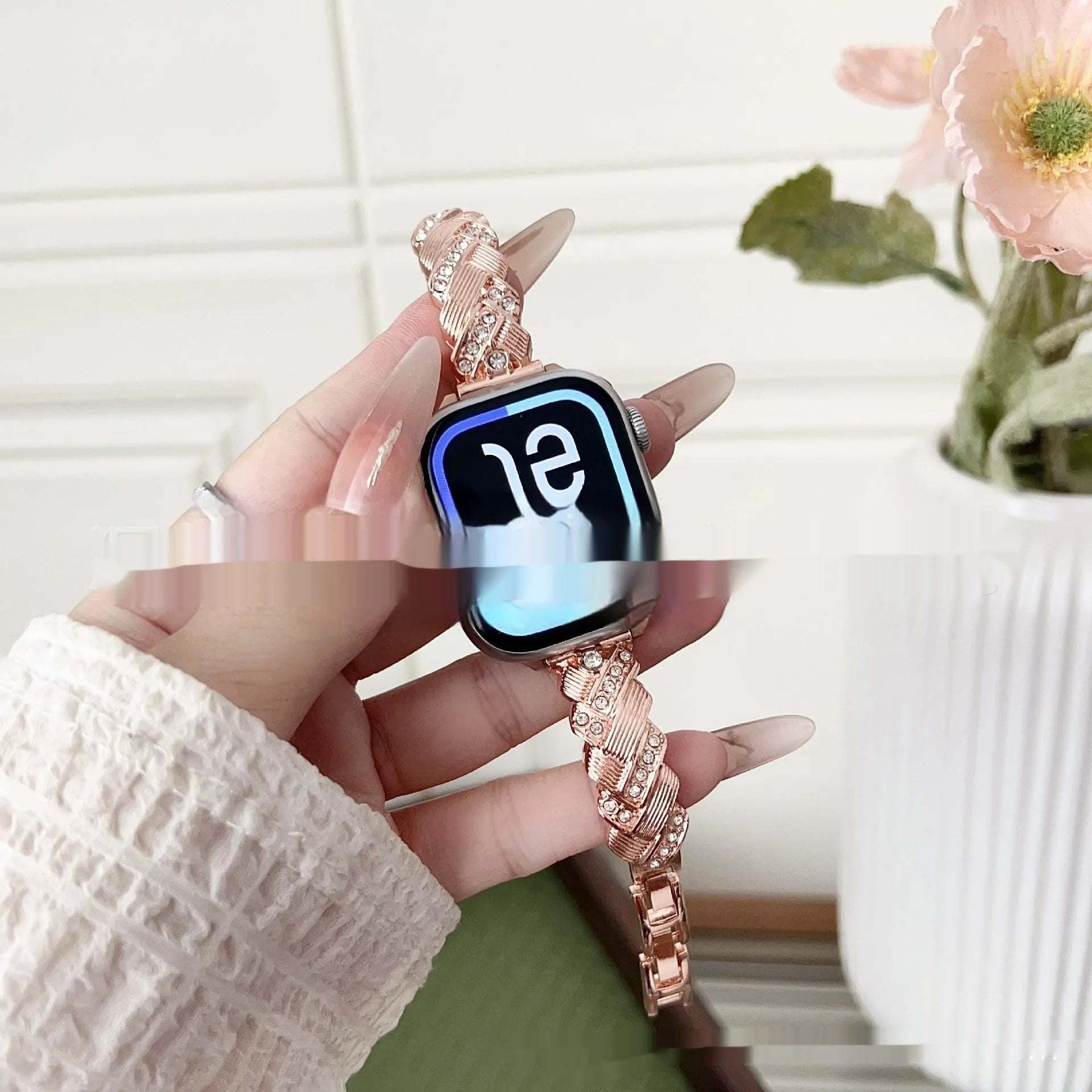 Zinc alloy twist-design Apple Watch band in silver, rose gold, gold, black, and starlight colours on a grey background.