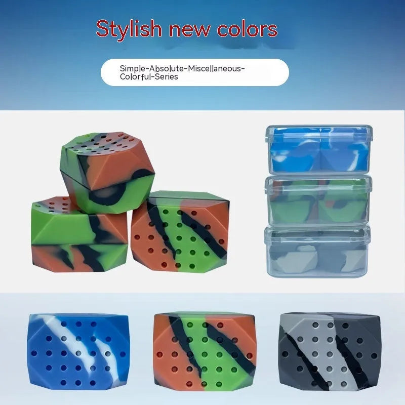 Two camouflage-pattern silicone facial muscle fitness balls for jawline training in a transparent box.