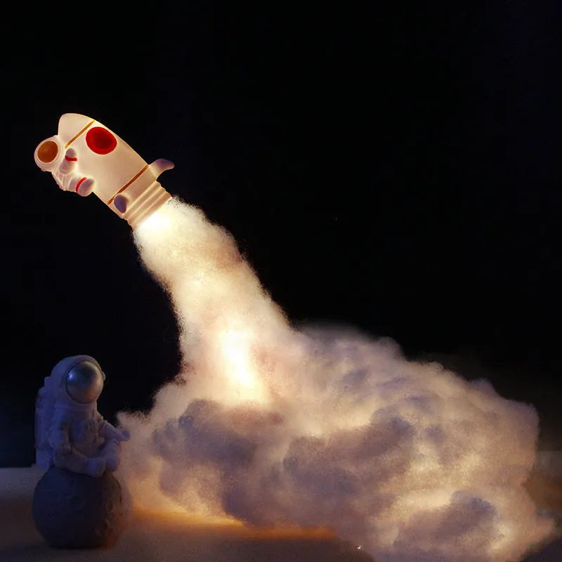 DIY astronaut rocket LED night light kit components including model, string lights, straws, and chassis.