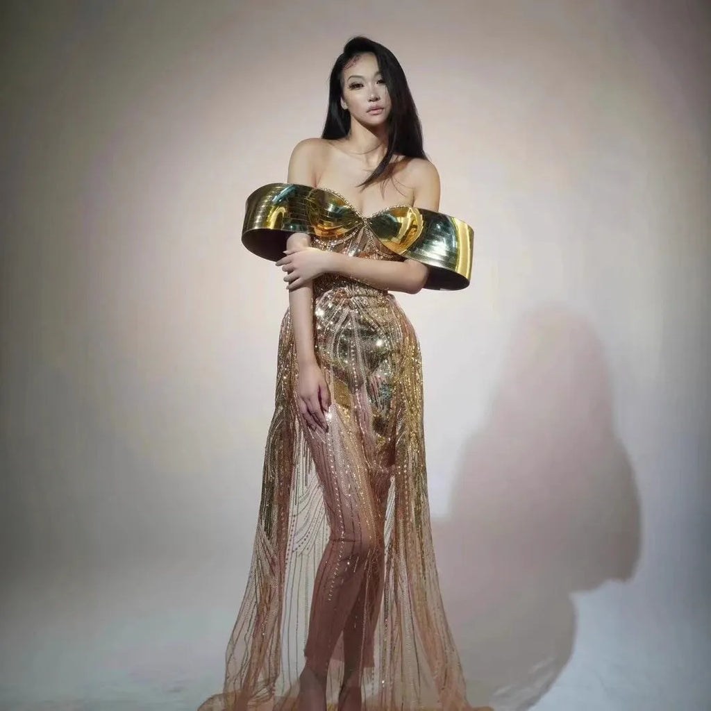 Gold strapless sequin evening dress with a voluminous tulle skirt and a high thigh split.