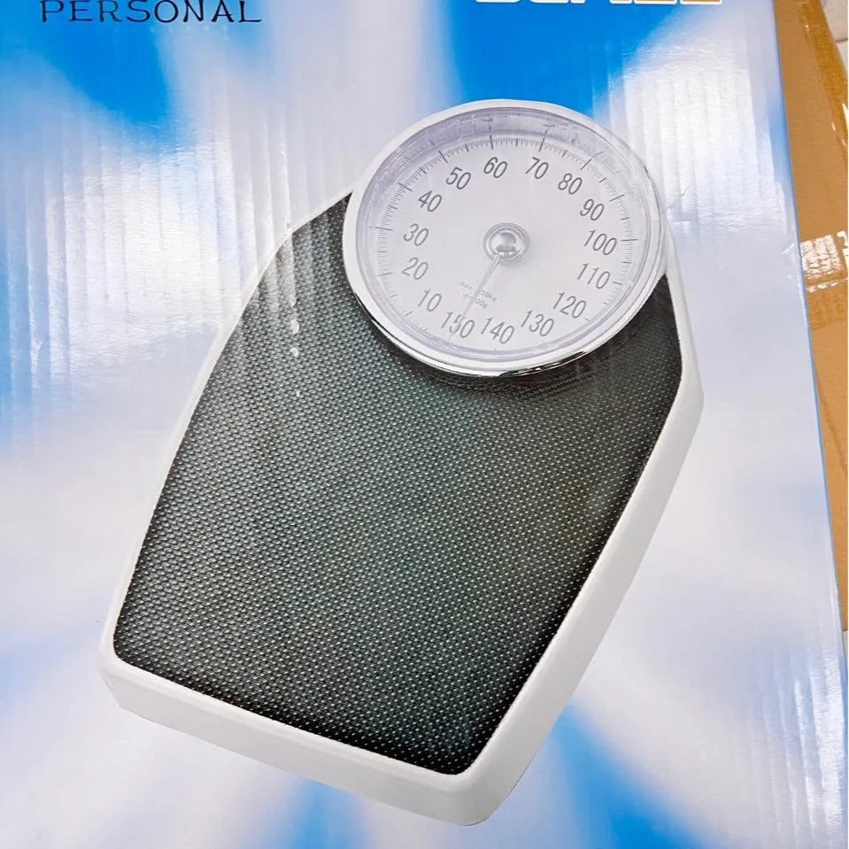 Black mechanical body weight scale with large dial display measuring 47x35x11cm