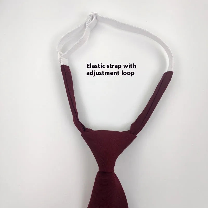 Solid colour men's cotton bow tie in arrow style laid flat, showing navy blue colour option.