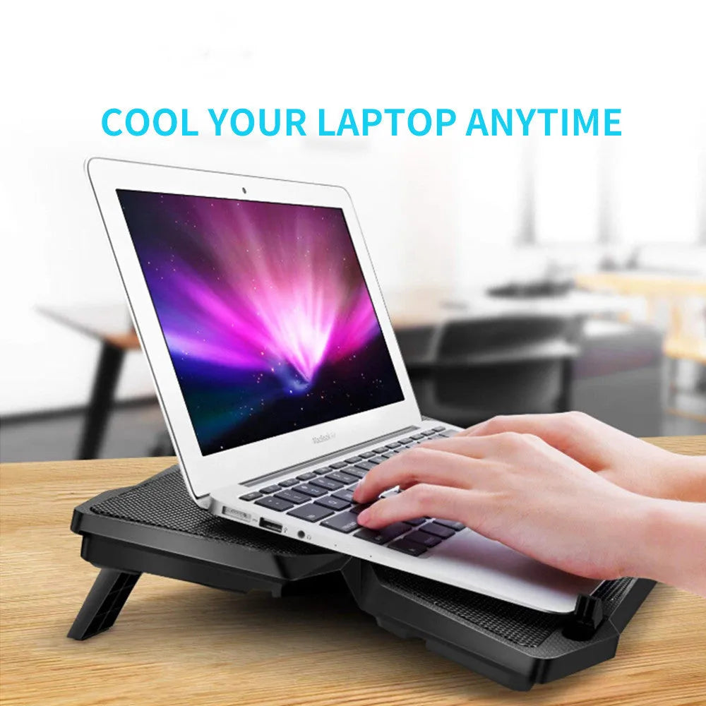 Blue computer cooling pad with four illuminated fans and USB ports