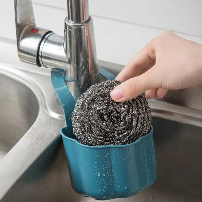 Nordic-style plastic sink drain basket in dark blue colour with water drainage slots
