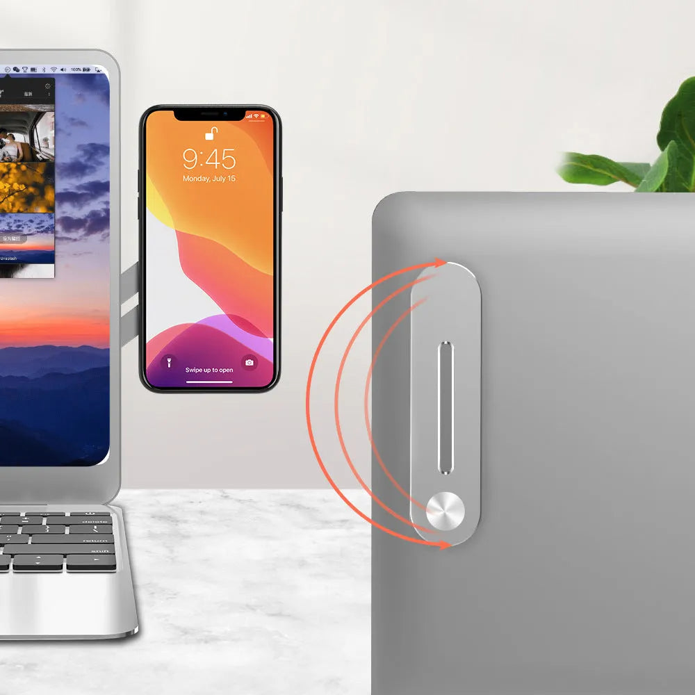 Aluminum laptop side mount bracket holding a mobile phone next to a laptop screen.