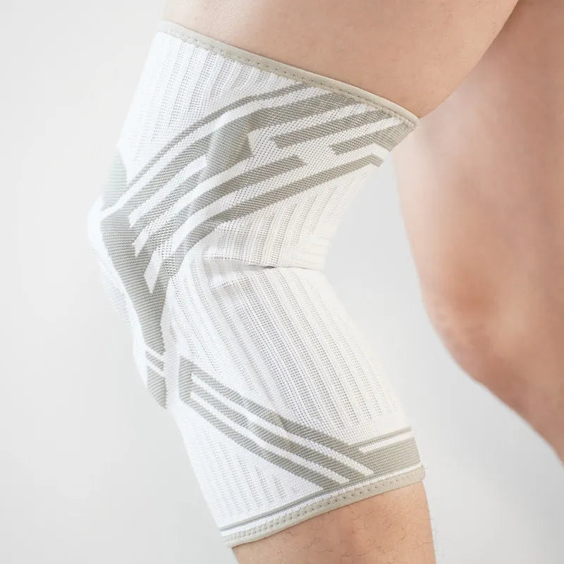 Blue high elasticity cotton knee pad for sports on an adult knee.