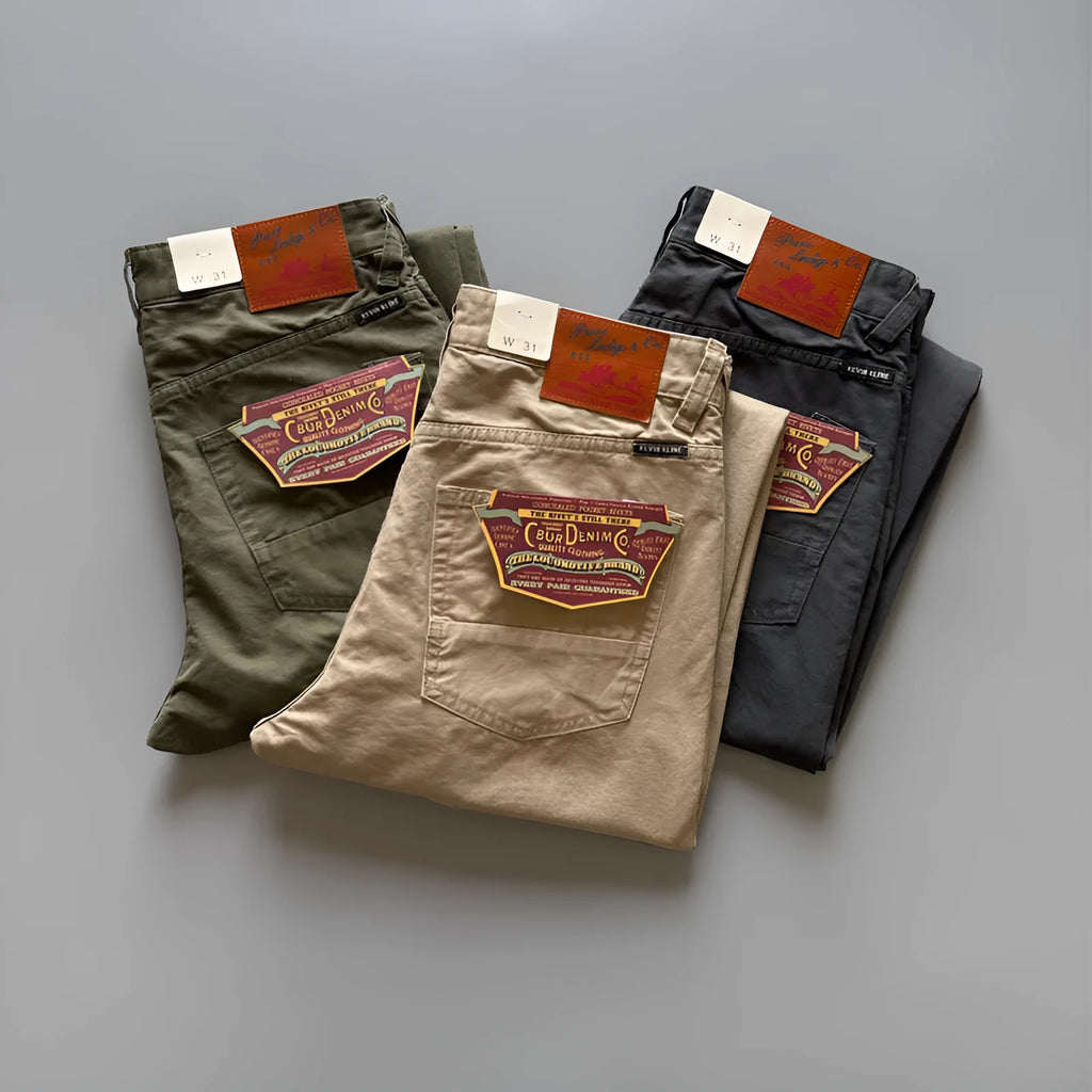Men's straight leg cotton casual trousers in grey, shown on a model.
