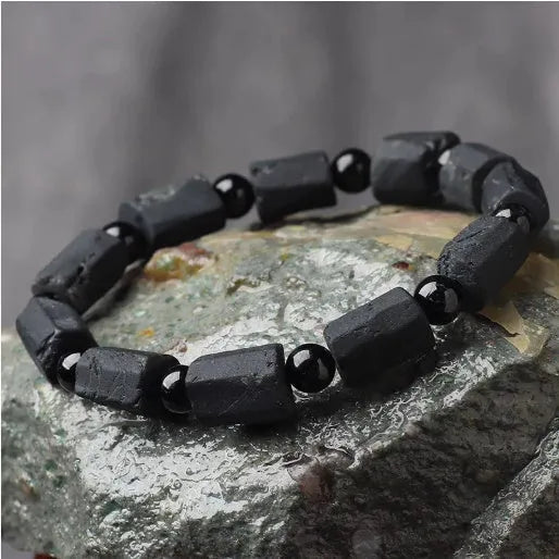 Natural black tourmaline rough stone bracelet with 10mm beads showing textured stone surfaces