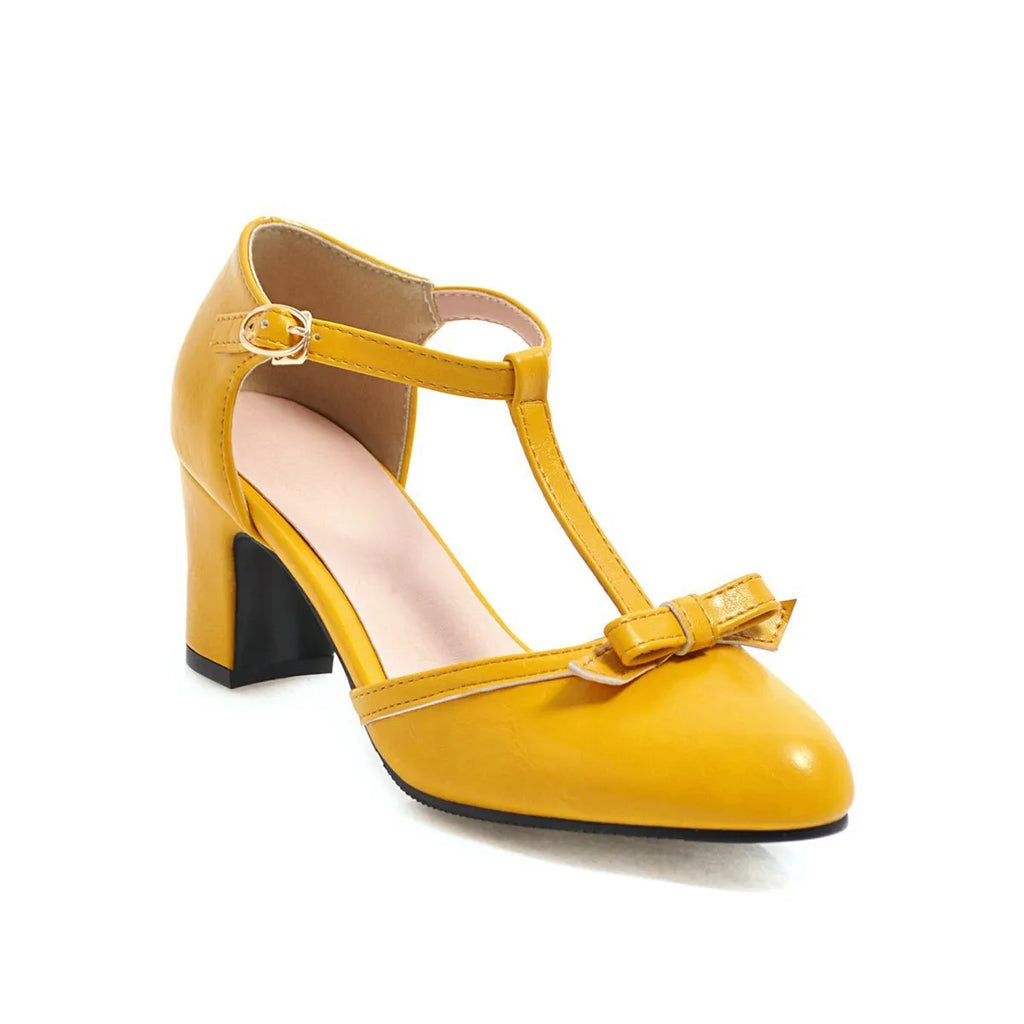 Women's apricot coloured sandals with a chunky 6.5cm heel, bow tie decoration, and a single buckle strap.