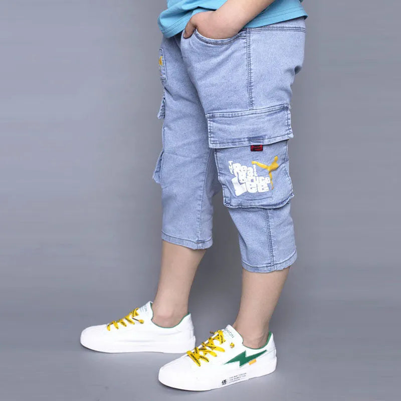 Boys loose stretch cropped jeans in blue cotton with high waist, sizes 105cm to 170cm