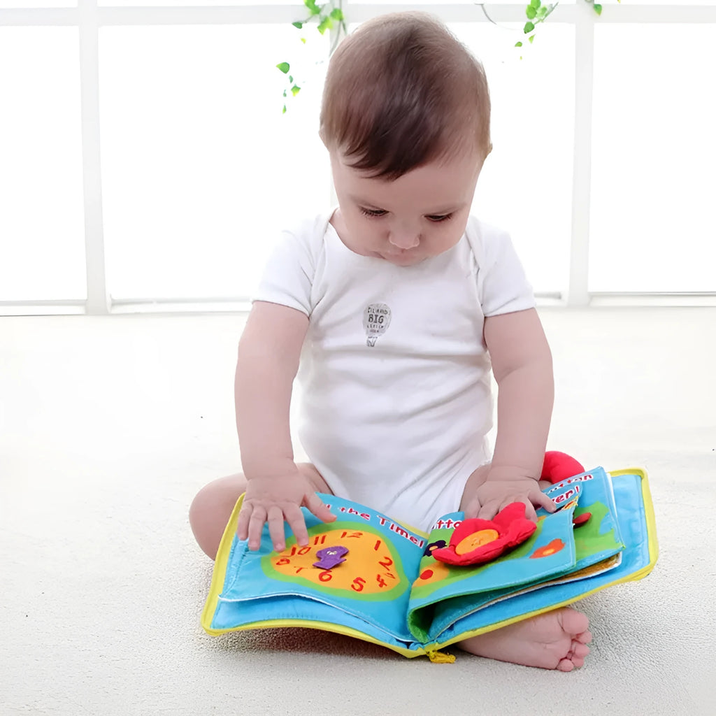 Multi-functional soft cloth baby book with zip and carry handle, 18.5cm wide by 20cm high, 12 pages.