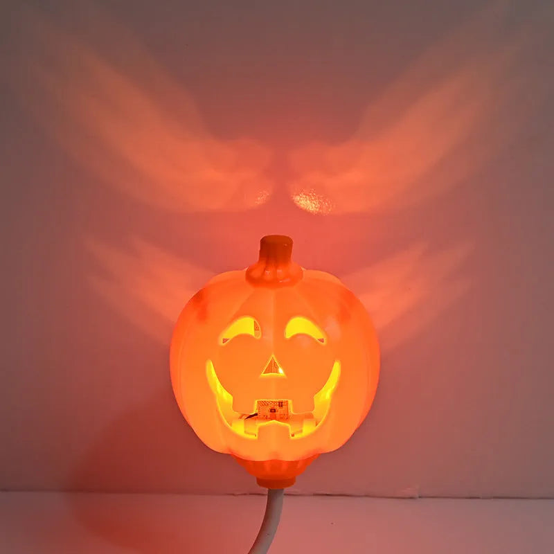 Plastic pumpkin lamp with yellow or purple light option, USB charging, 8.3cm wide by 22cm tall