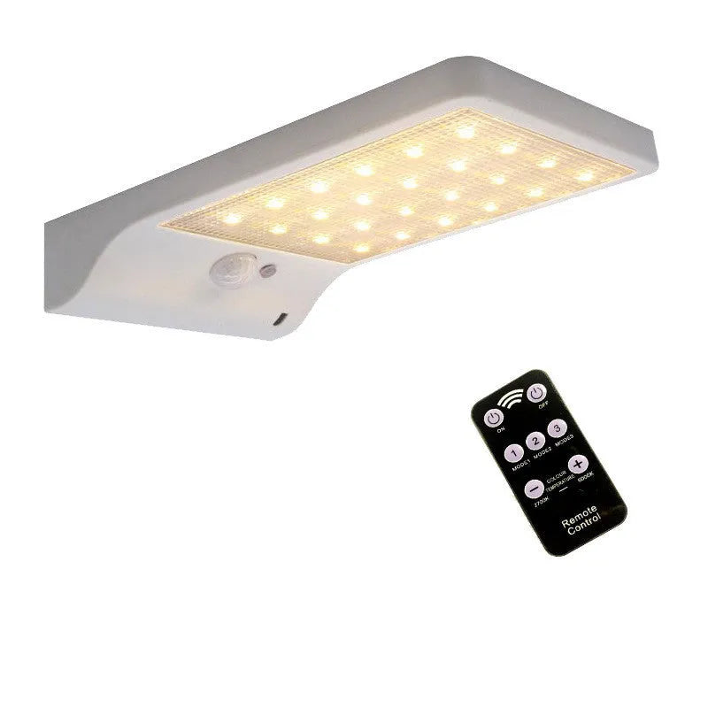 IP65-rated outdoor solar garden light with LED illumination in black or white colour options