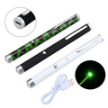 Black, Camouflage, and White 5mW green laser pointer pen on a table.