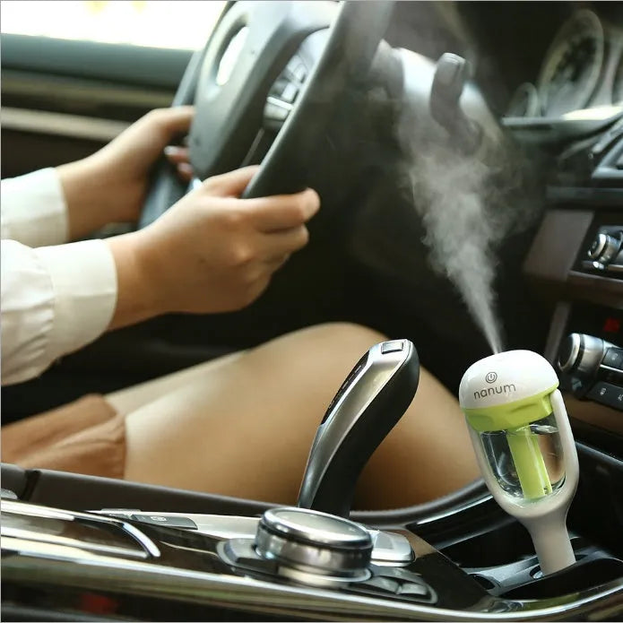 Compact blue car humidifier with 180 degree rotation spray for vehicle air quality improvement