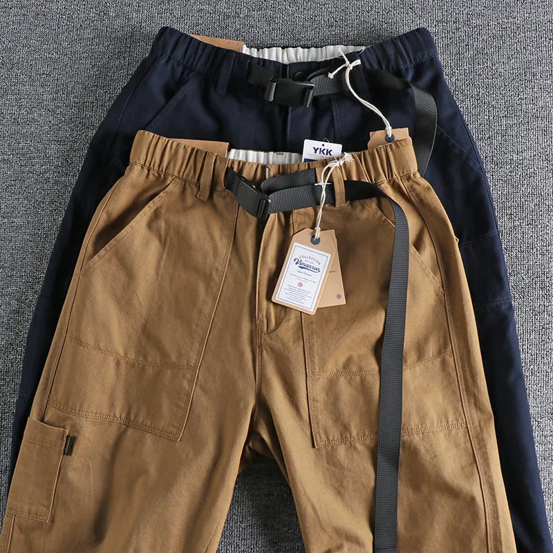 Men's cotton work trousers with N I buckle belt in dark blue colour showing three-dimensional cutting construction