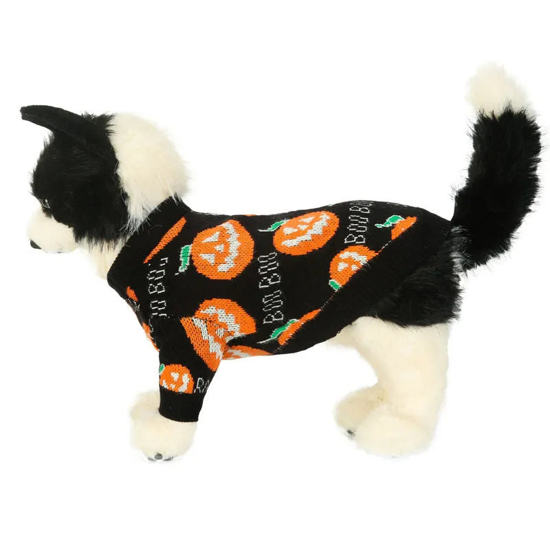 Black dog sweater with a large orange Halloween pumpkin print on the back.