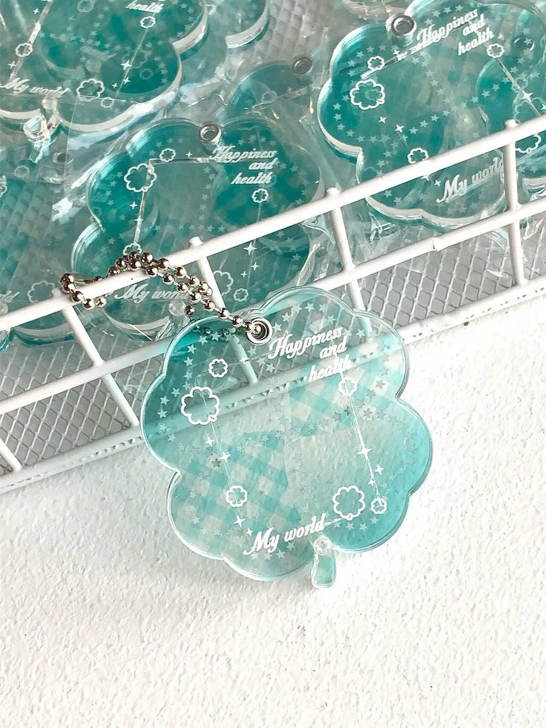 Acrylic four-leaf clover phone pendant in three colour variations