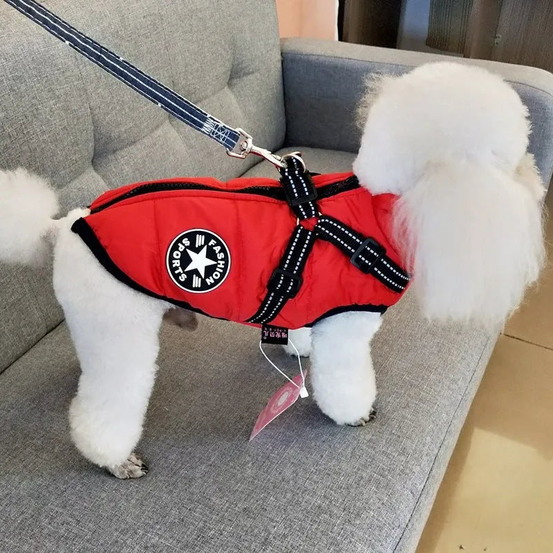 Red waterproof dog coat with integrated harness for winter outdoor use