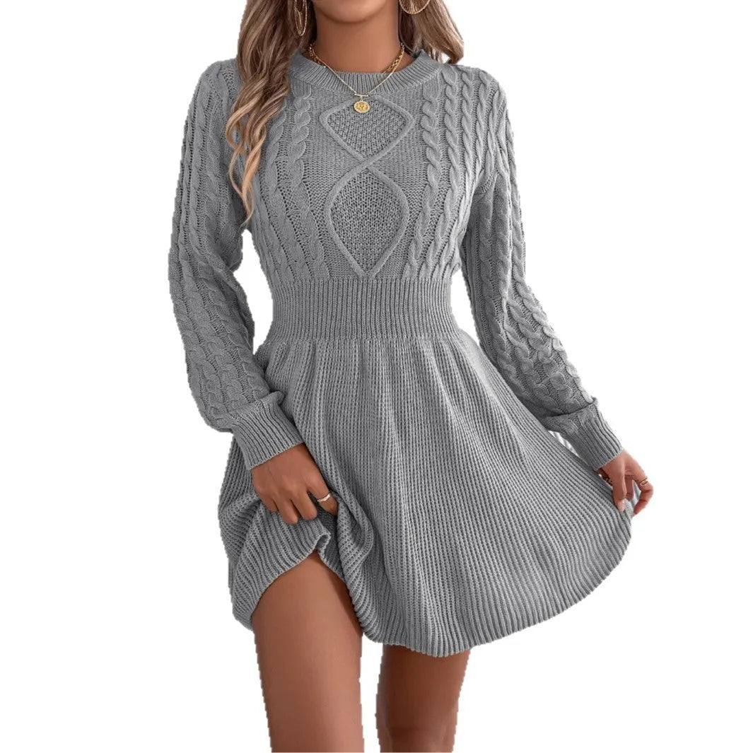Black knit sweater dress with lantern sleeves and a twisted elastic waistband.