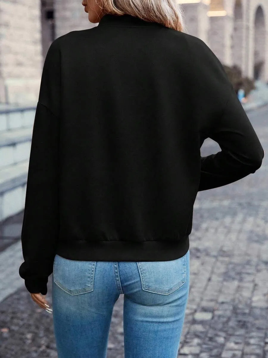 Women's solid black casual zip jacket with faux pockets and long sleeves
