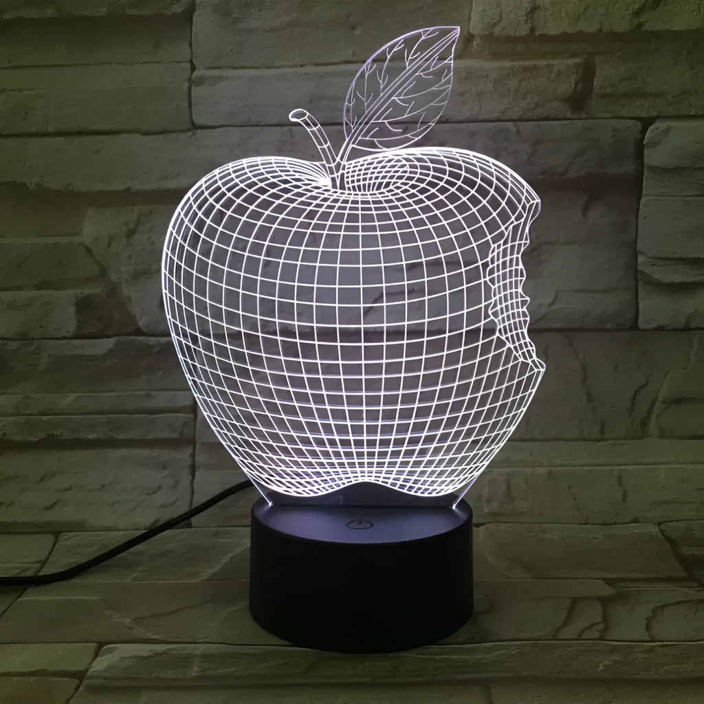 3D fruit-shaped colourful LED night light with touch control on a surface