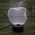 3D fruit-shaped colourful LED night light with touch control on a surface