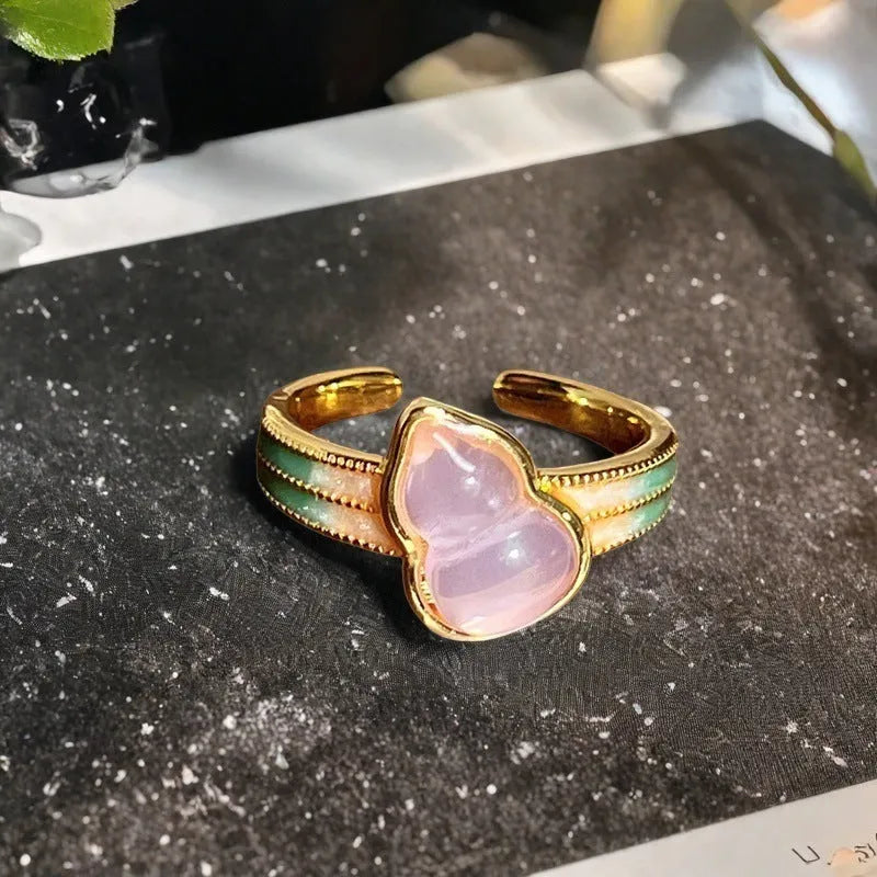 Adjustable copper ring featuring a gourd, flower, and bow design with zircon inlay in New Chinese style.