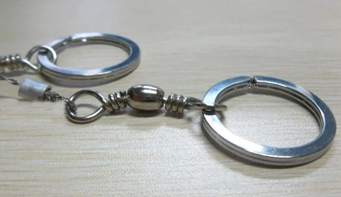 Stainless steel survival wire saw with pull rings showing 55cm cutting length